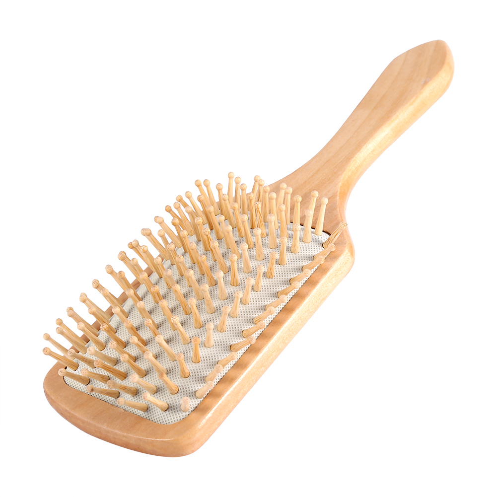 brosse en bois cheveux bouclés