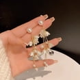 thumbnail image 6 of delicate Dangle Drop Earrings, Adorned with White Faux Flowers, Faux White Flowers and Mother of Pearl, for Bridal Events, Garden Weddings, and Feminine Everyday Ensemble Styling, 6 of 8