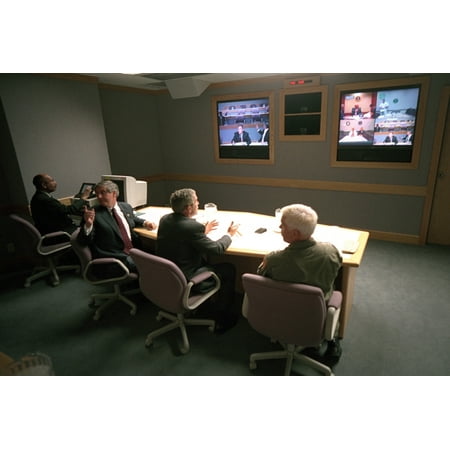 President George W. Bush In A Multiscreen Video Conference At Offutt