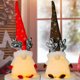 thumbnail image 4 of Adorno Navideño de Reno Rudolph con Luces LED, Muñeco Creativo Sin Rostro en Rojo, Ideal para Decoración de Hogar, Hecho de Tela y Algodón, Incluye LED Cálido, Requiere 3 Pilas AAA (No Incluidas), 4 of 6
