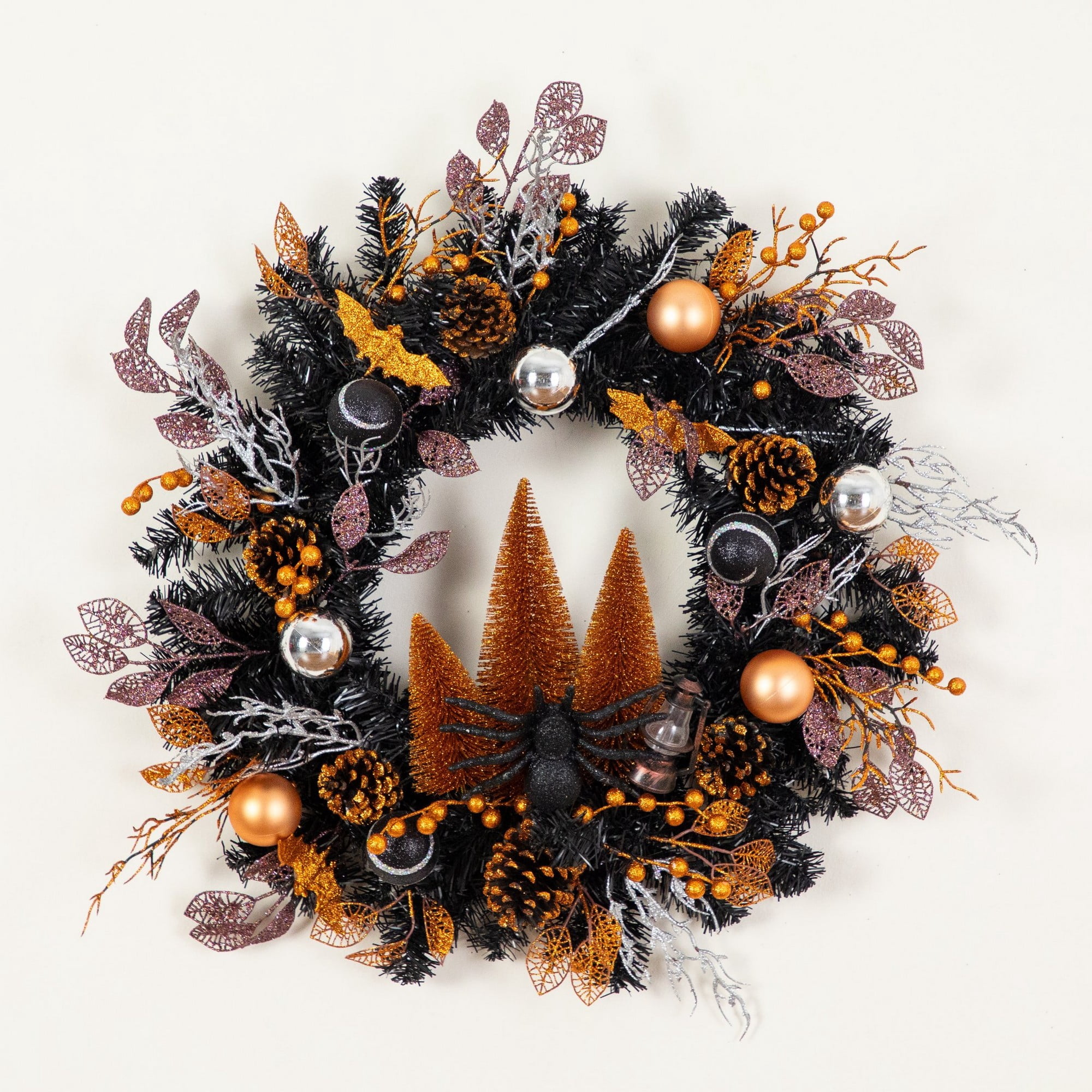 24in. Artificial Halloween Black Mixed Foliage Wreath with Bats, Pinecones and Trees