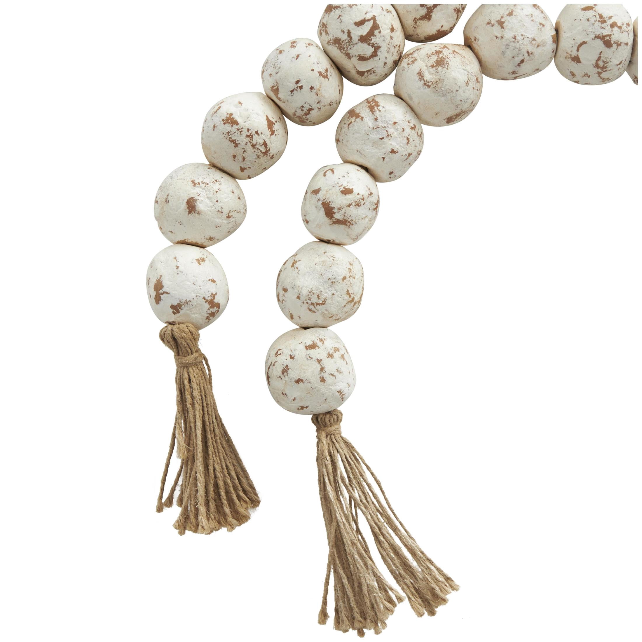 DecMode Handmade Round Intricately Shaped Large Distressed White Ceramic Garland with Tassel