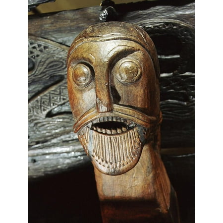 Carved On The Walls Fierce human mask carved on the side of the Oseberg cart, Viking, Norway, c850 Print Wall Art By Werner Forman ()