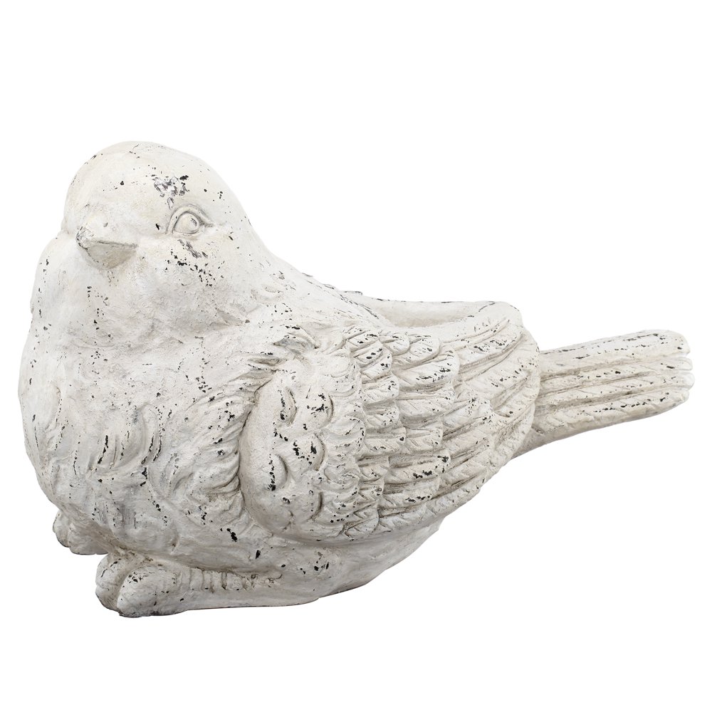 yellow ceramic bird figurine