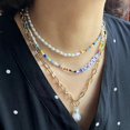 thumbnail image 1 of Collar de cuentas de arroz de metal estilo bohemio, cadena de clavícula de perlas con alfabeto de nicho retro para mujer, conjunto de 3 piezas, 1 of 5