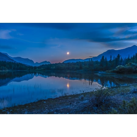 Waxing Crescent Moon (July 2 2014 - The waxing crescent moon over Middle Lake in Bow Valley Provincial Park Alberta Canada east of Banff and Canmore Poster)