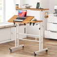 thumbnail image 1 of Petit Bureau Debout Mobile avec Roues, Chariots Portatifs Roulants pour Ordinateur Portable avec Porte-Gobelet, Hauteur Réglable, Table d'Ordinateur pour Se Tenir Debout Ou Assis, Chêne, 1 of 5