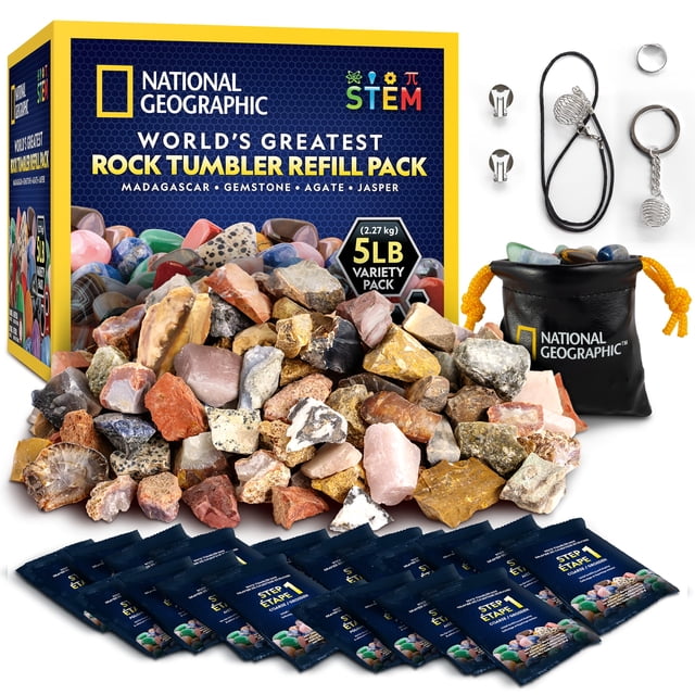 National Geographic Rock Tumbler Refill Kit with 5 lb. of unpolished rocks and rough gemstones, including agate, jasper, Madagascar, and gemstone mixes. Features 20 rock tumbler grit packets for five tumbling cycles, jewelry settings, a storage pouch, and a detailed learning guide. Ideal for geology toys and STEM learning. Multicolor rocks displayed alongside packaging and accessories.