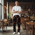 thumbnail image 5 of Men's pajama pants with brown football and playbook pattern on black background， soft home pajama pants， casual and comfortable loose fit pajama pants， elastic waistband, 5 of 10