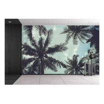 wall26 - Branches of Coconut Palms Under Blue Sky - Removable Wall Mural | Self-Adhesive Large Wallpaper - 100x144 inches