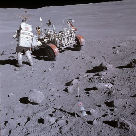 An astronaut and a lunar roving vehicle during an Apollo moonwalk Canvas Art - Stocktrek Images (28 x 28)