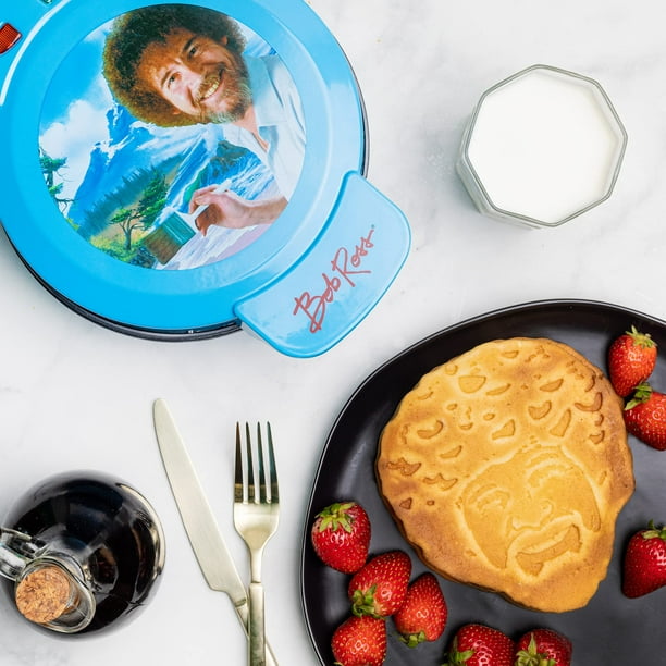 Wafflera Uncanny Brands con el Icónico Rostro de Bob Ross