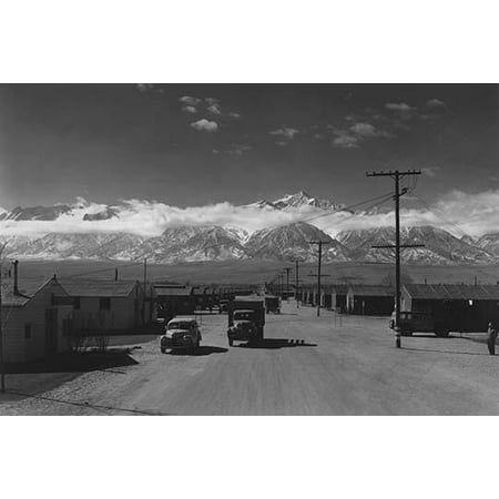 Two way traffic in the camp and camp buildings  Ansel Easton Adams was an American photographer best known for his black-and-white photographs of the American West  During part of his career he was