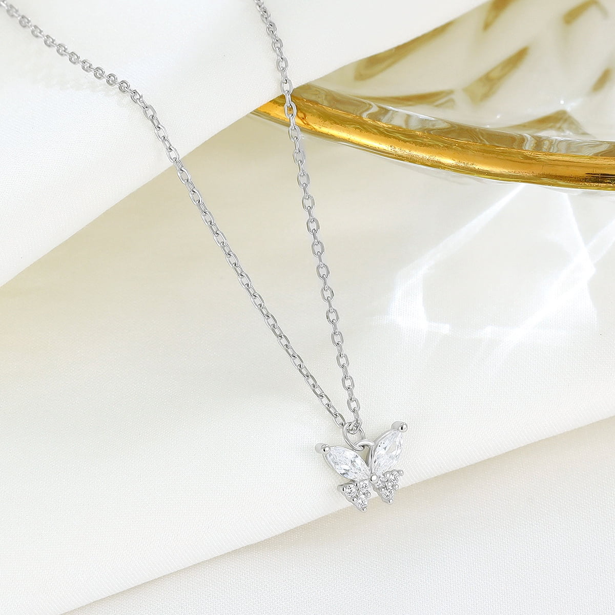 A 925 sterling silver butterfly necklace, set with dazzling diamonds, features a unique and elegant design. This simple butterfly clavicle necklace is an ideal high-end gift for women and a perfect g