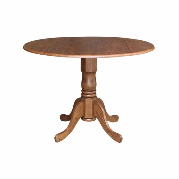 42" Round Solid Wood Dual Drop Leaf Pedestal Table in Oak Finish