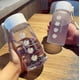 thumbnail image 2 of Botellas de agua de plástico transparente Margarita pequeña, 500ml, sin Bpa, creativa botella de agua esmerilada con cuerda portátil, taza de té de viaje Ns2, 2 of 4