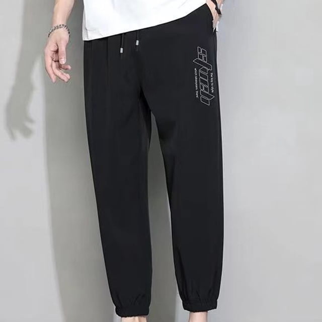 Pantalones casuales de moda para hombre, con bolsillos y tobillos, color liso, cintura elástica y cordón ajustable.
