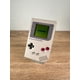 thumbnail image 1 of Consola Original de Nintendo Game Boy Classic GameBoy Gris: 100% Probada, Funciona Muy Bien, Es Rara y Coleccionable., 1 of 6