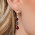 thumbnail image 3 of Gem Stone King 18K Rose Gold Plated Silver Red Rhodolite Garnet 3 Stone Dangle Earrings for Women (5.70 Cttw, Gemstone January Birthstone, Oval 8X6MM, 7X5MM and 6X4MM), 3 of 6