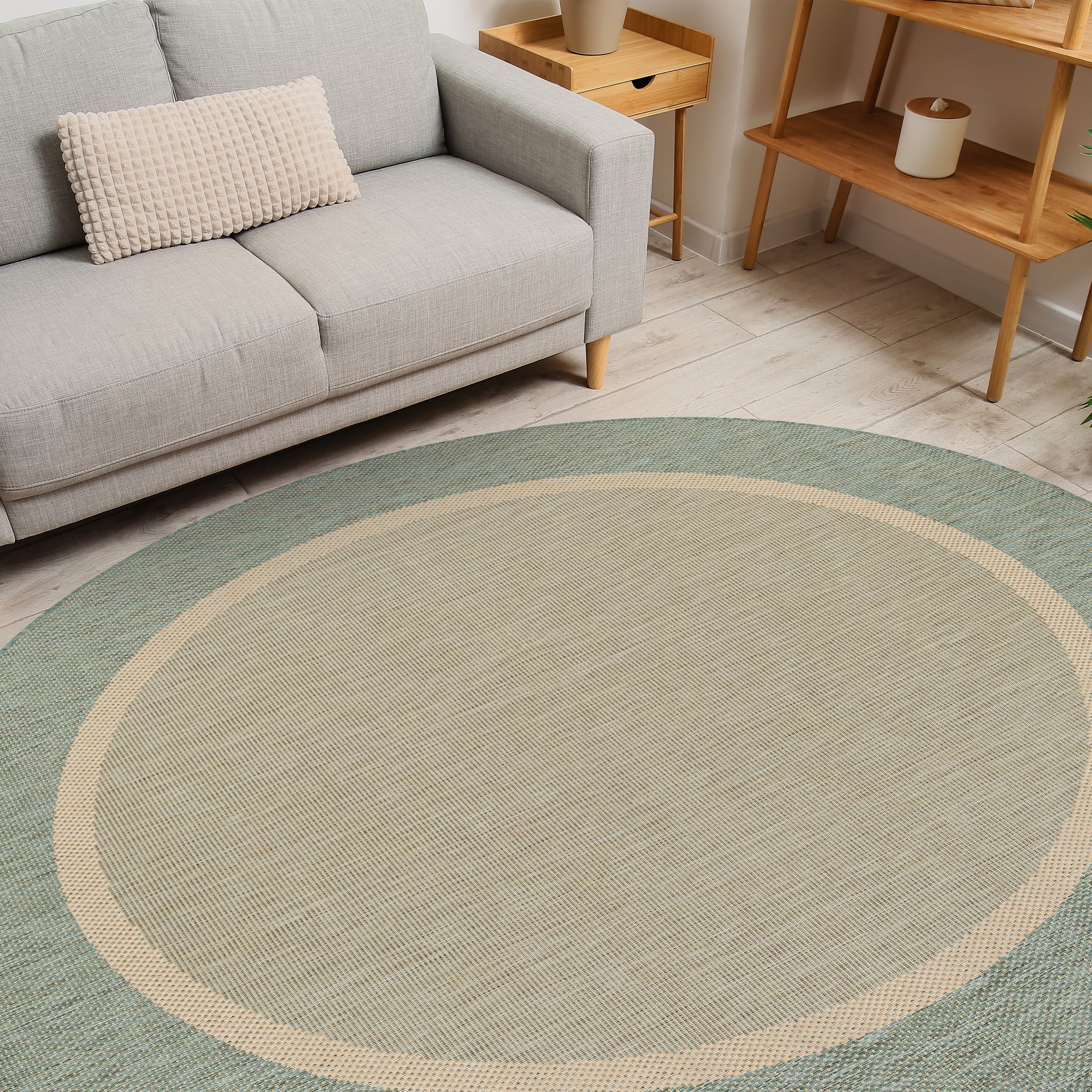 8.5' Beige and Green Bordered Round Polypropylene Area Throw Rug