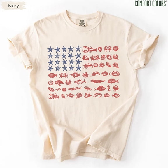 VibeNest Studio Unisex Seashell American Flag Coastal Nautical 4th of July Garment Dyed Graphic T-Shirt