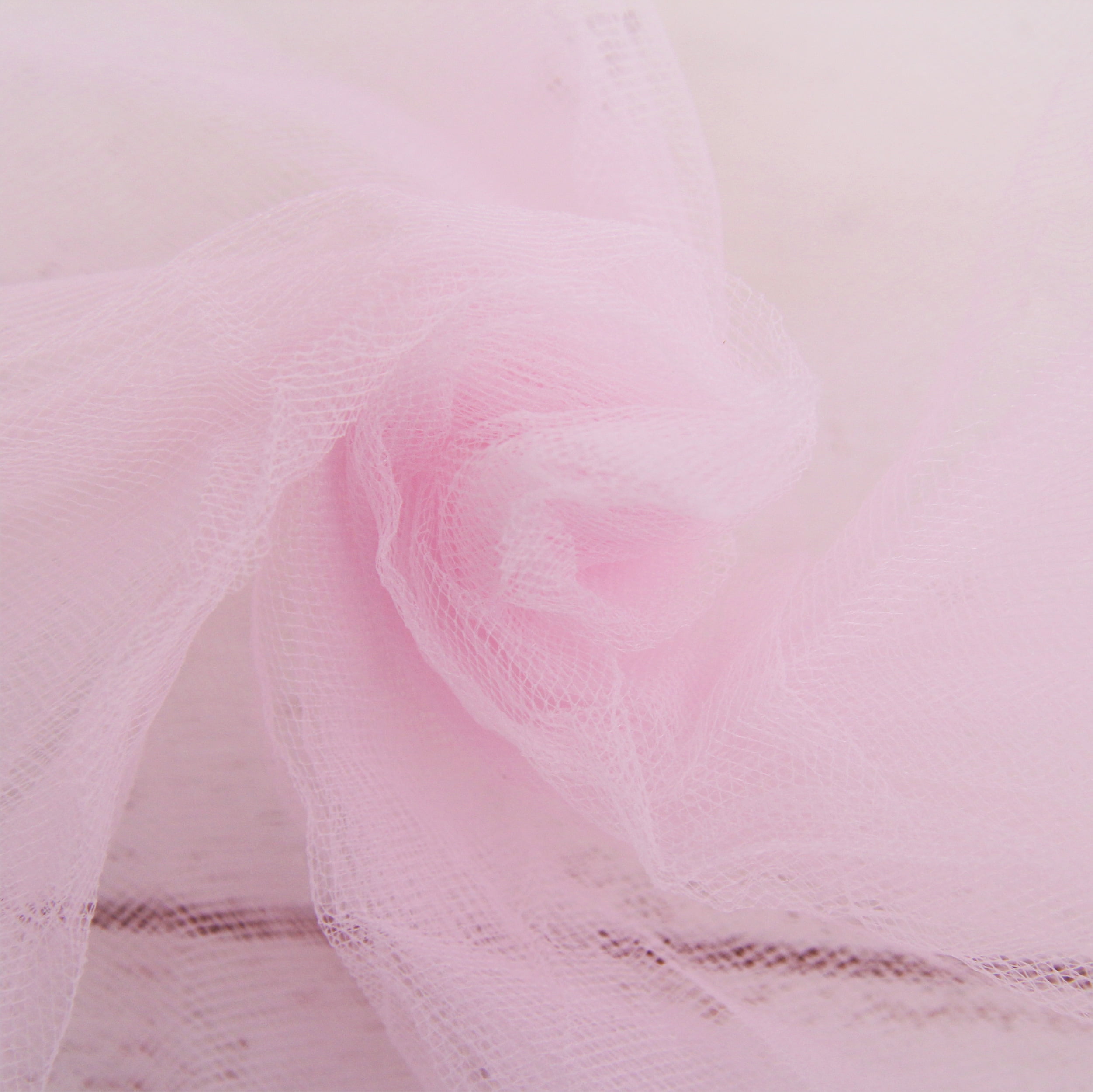This pretty-in-pink confection features tulle that's right from the bolt.  There's no pattern required here. We used three rectangle…