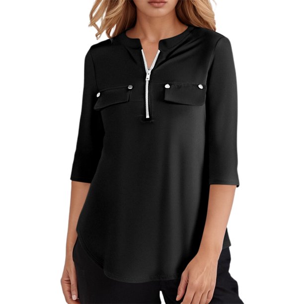 Camiseta informal de mujer con mangas 3/4, cremallera y bolsillos. Prenda funcional y elegante.
