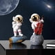 thumbnail image 2 of Adorno de astronauta YONGSHENG Kickball dorado, 2 of 5