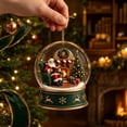 thumbnail image 6 of ZENVIVE Charming Christmas Snow Globe Ornament, 3.5 Inch Resin And Glass Hanging Piece With Gold Cord, Festive Village Scene Display For Tree Home Party, Santa Chair Fireplace Scene, 6 of 8