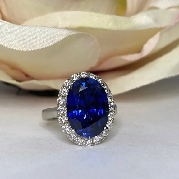 Women's 4TCW Oval Cut Lab Created Blue Sapphire 3-Stone Ring in 14K White Gold Plated