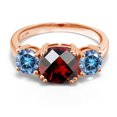 thumbnail image 2 of Gem Stone King 18K Rose Gold Plated Silver Red Garnet and Persian Blue Moissanite 3 Stone Engagement Ring for Women (3.50 Cttw, Gemstone January Birthstone, Cushion Checkerboard 8MM, Size 5), 2 of 5