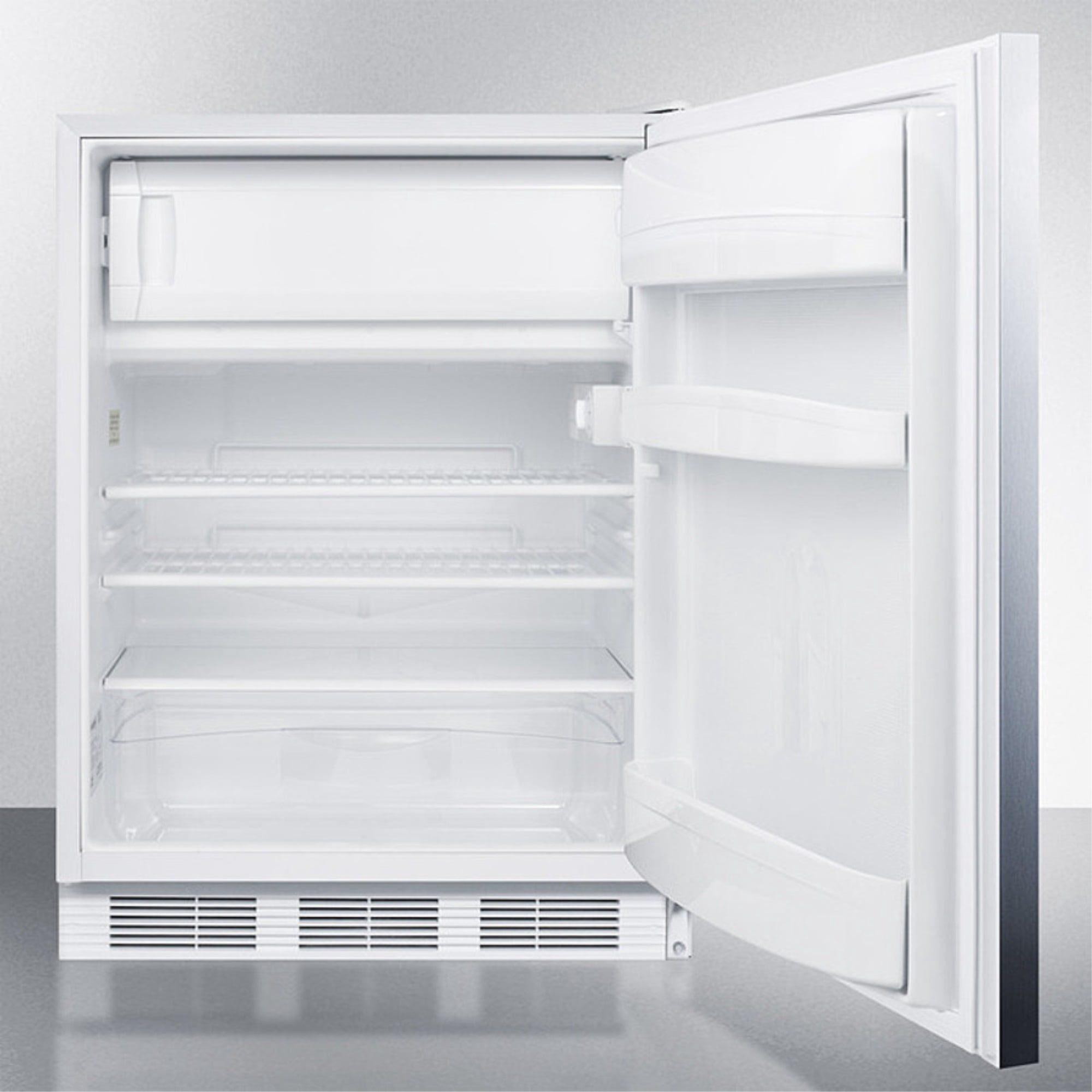 Freestanding counter height refrigerator-freezer for residential use, cycle defrost with a stainless steel wrapped door, towel bar handle, and white cabinet