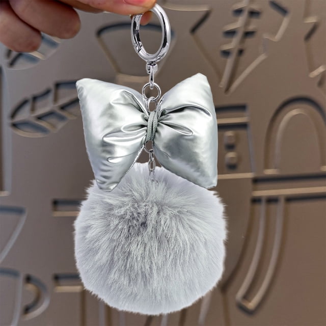 Bolsa redonda navideña para niña | Llavero con lazo para bolsos y llaves | Colores rosa y gris | Idea de regalo para estas fiestas