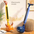 thumbnail image 2 of New Otamatone Japanese Electronic Musical Instrument Portable Synthesizer Funny Magic Sounds Toys Creative Gift for Kids Adults Pig, 2 of 6