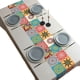 thumbnail image 1 of Se producen flores de colores vivos bordadas con un mantel ovalado de color blanco cremoso., 1 of 5
