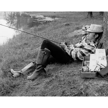 - 1970s Man Sleeping Against A Tree Trunk While Fishing In A Lake Poster Print By Vintage Collection