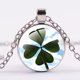 thumbnail image 1 of SONGDA-collar de trébol de cuatro hojas para hombre o mujer, colgante redondo de Metal con diseño de flores, regalo de joyería de la suerte, 1 of 4