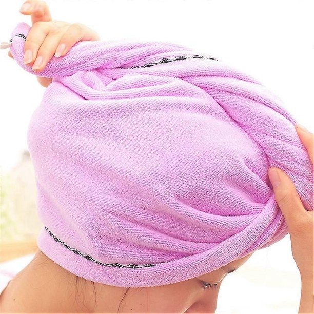 Toalla rosa de secado rápido para el cabello con diadema elástica para la ducha y el baño.