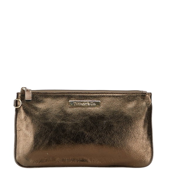 Pre-Owned Tiffany & Co. logo plaque pouch in bronze leather for women. (Good)
