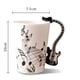 thumbnail image 2 of Taza Con Mango Guitarra Negra Y Notas Musicales Ondulantes HappyWare Guitarra Negra, 2 of 3