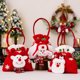thumbnail image 1 of Bolsas de regalo navideñas con muñecos de muñeco de nieve de Papá Noel - Bolsillo de cordón tejido de 8,66x7,48 pulgadas para caramelos y pequeños regalos, 1 of 6