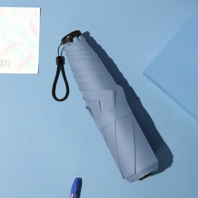 Portable Manual Travel Umbrella with Water-Resistant Vinyl Coating and UPF50+ Sun Protection - Lightweight Design, Windproof Fiber Frame, Thermal Insulation for Comfortable Outdoor Use