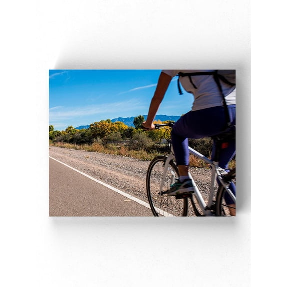 Riding A Bike On The Road Wrapped Canvas -Image by Shutterstock,