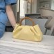 thumbnail image 5 of Bolso de mano con diseño de nicho amarillo y asa de madera con pliegues en forma de nube para mujer, nuevo bolso mini oblicuo para primavera y verano Tide, 5 of 5