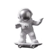 thumbnail image 1 of Figura de astronauta en patineta, estatua decorativa de escritorio, creativa y adorable. Plata, 1 of 9