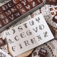 thumbnail image 4 of Juego de sellos de goma con el alfabeto de madera, 27 piezas, letras mayúsculas, 4 of 6