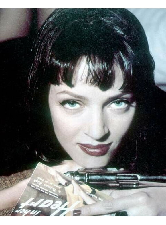Uma Thurman holds pistol and pulp magazine in pose for Pulp Fiction 8x10 photo