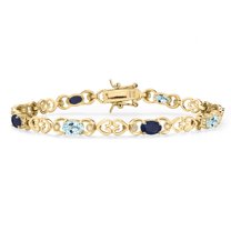 Gem Stone King 18K Yellow Gold Plated Silver Sky Blue Topaz and Blue Sapphire and Lab Grown Diamond Bracelet for Women | 4.23 Cttw | Gemstone November Birthstone | Oval 6X4MM | Length 7.25 inches