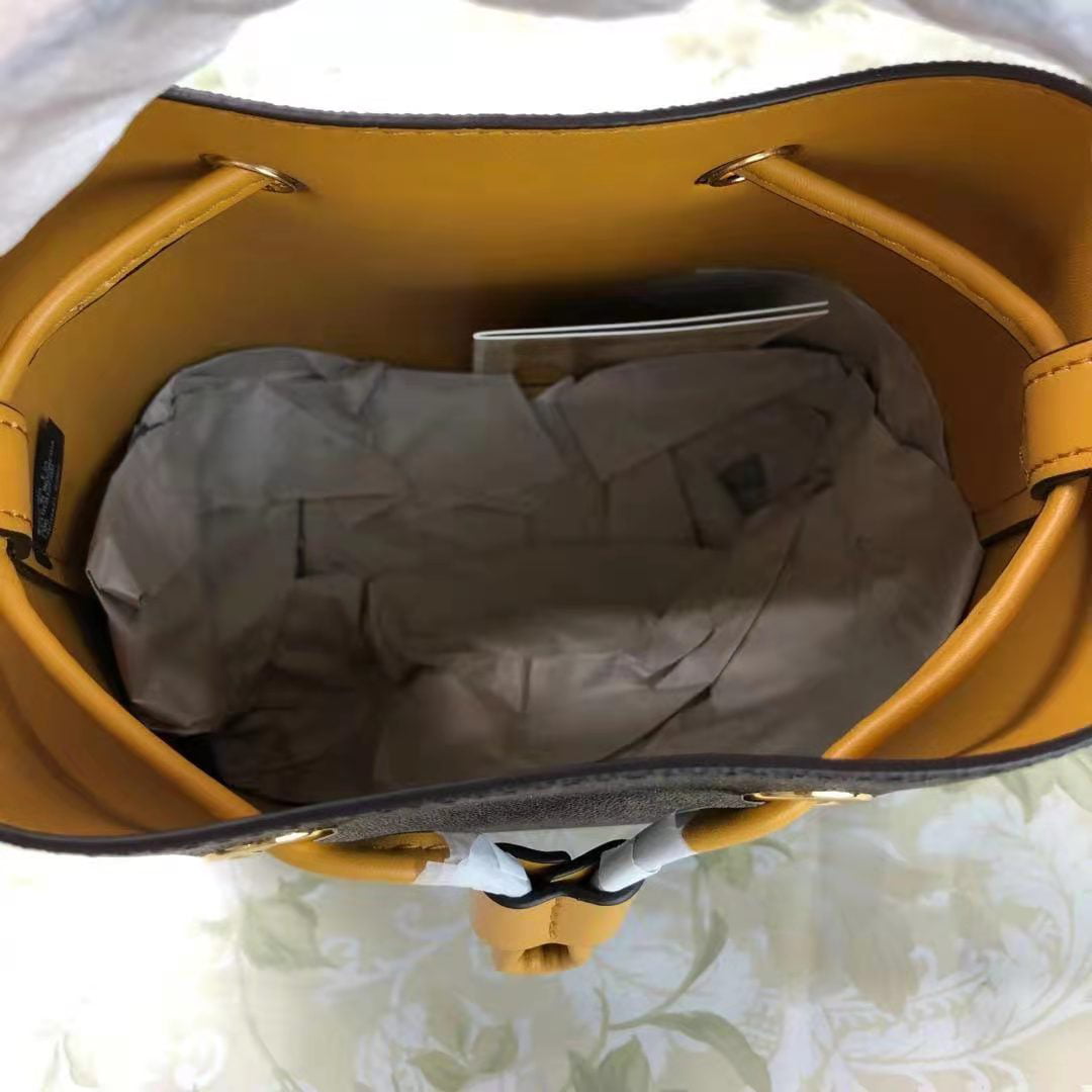 Michael Kors Suri Small Bucket Bag Crossbody Brown MK Marigold Yellow -  ShopperBoard