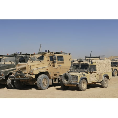 A British Armed Forces Snatch Land Rover parked next to other military vehicles Canvas Art - Andrew ChittockStocktrek Images (35 x 23)